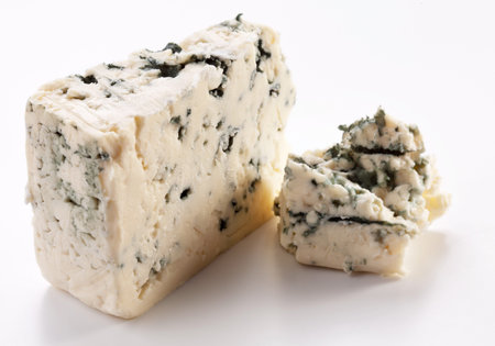Pieces of blue cheese on a white background. の写真素材