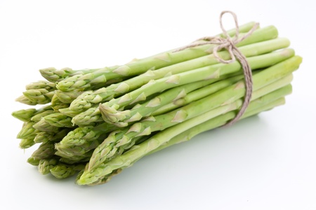 Sheaf of asparagus on a white background.の写真素材