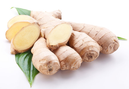 Fresh ginger with leaves isolated on white background.
