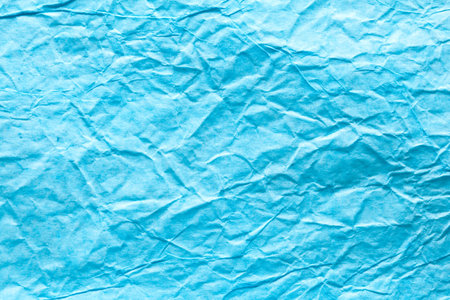 Image texture of crumpled blue paper.