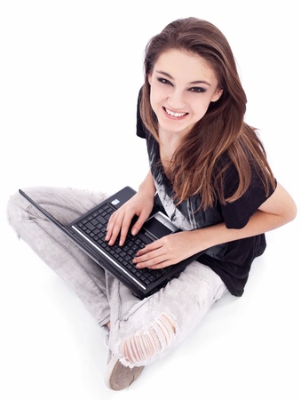 Girl working with laptop. Picture on a white background.の写真素材
