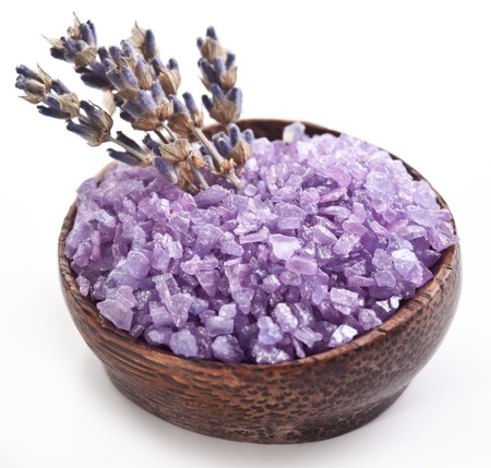 Sea-salt and dried lavender on a white background.の写真素材