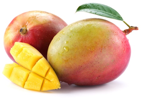 Mango with slices on a white background.の写真素材