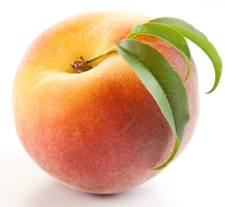 Ripe peach with leaves isolated on a white background.の写真素材