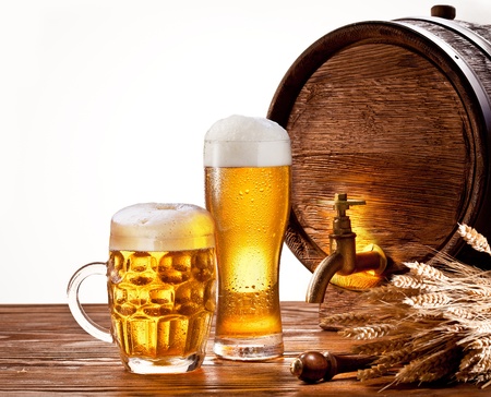 Beer barrel with beer glasses on a wooden table  Isolated on a white background の写真素材
