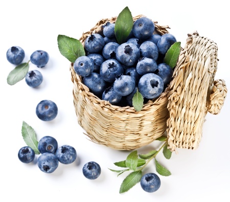 Blueberries in a basket on a white background.の写真素材