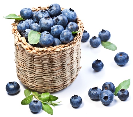 Blueberries in a basket on a white background.の写真素材