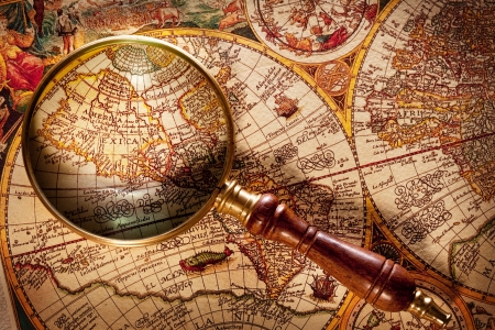 Magnifying glass on old map.の写真素材