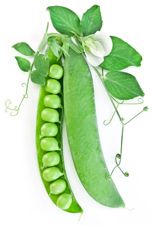 Pods of green peas with leaves on white background.の写真素材