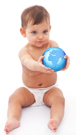 Baby sits at the floor with globe in her hand  Isolated on a white background の写真素材