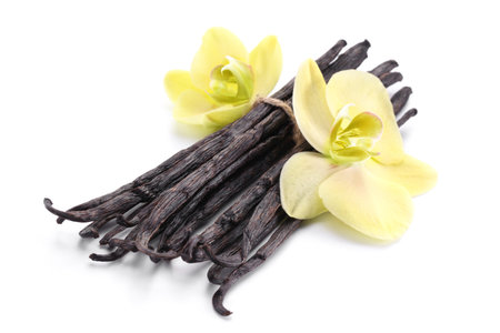 Vanilla sticks with a flower on a white background.