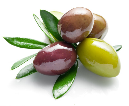 Olives with leaves on a white background.の写真素材