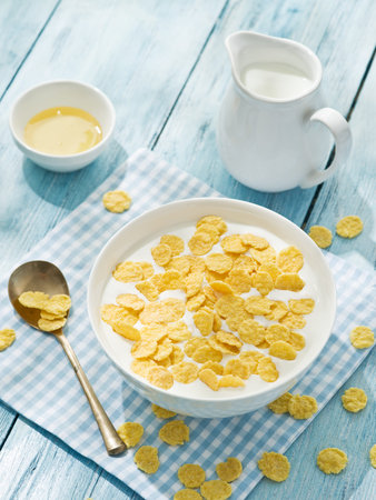 Cornflakes cereal and milk. Morning breakfast.