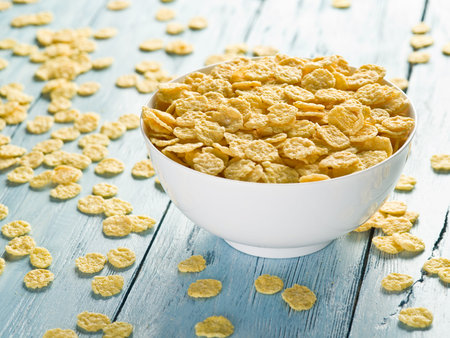 Cornflakes in the white bowl. Morning breakfast.