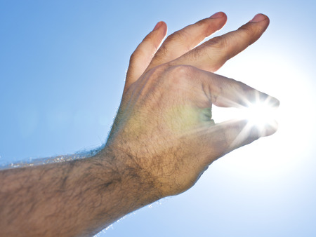 Sun "in the man's hand".の写真素材