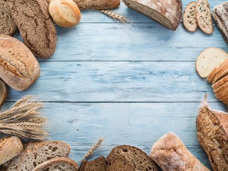 The bread and a wheat on the wooden desk.