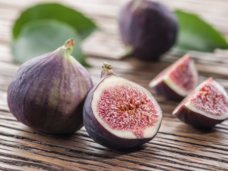 Ripe fig fruits on the wooden table.の写真素材