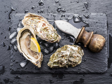 Raw oysters on the graphite board.