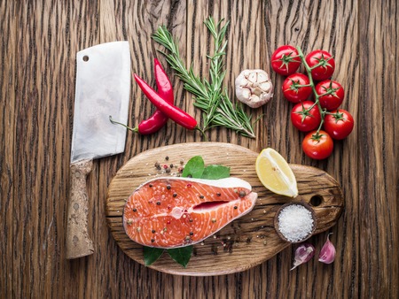 Fresh salmon on the cutting board. Cooking process.の写真素材