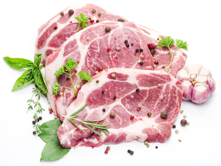 Raw pork meat steaks with spices on the white background.の写真素材