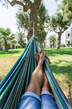 Relaxing in the hammock. Summer day.の写真素材