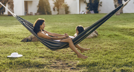 Mother and daughter are resting in the country side.