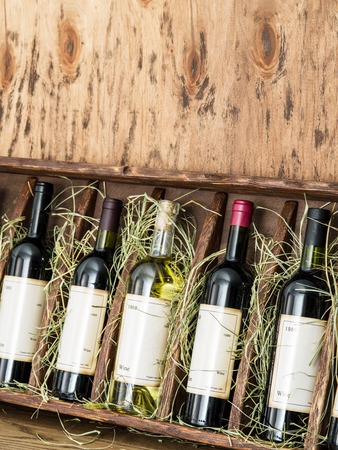 Wine bottles on the wooden shelf.のeditorial素材