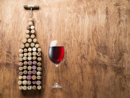 Wine corks in the shape of wine bottle on the wooden background.のeditorial素材