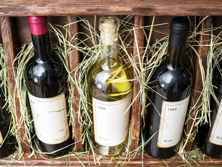 Wine bottles on the wooden shelf.のeditorial素材