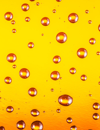Water drops on glass of beer. Close up.の写真素材