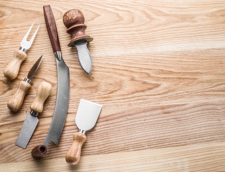 Kitchen utensils on the wooden background.の写真素材