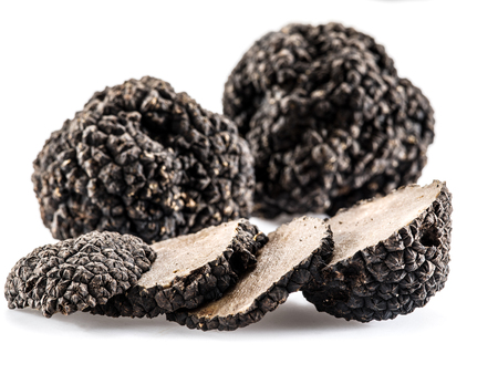 Black truffles isolated on a white background.の写真素材