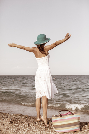Woman relaxing at the seaside. Vintage style.の写真素材