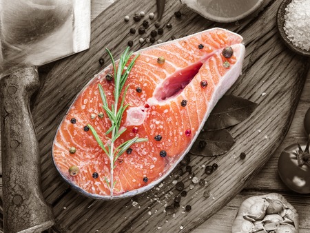 Fresh salmon on the cutting board. Cooking process.の写真素材