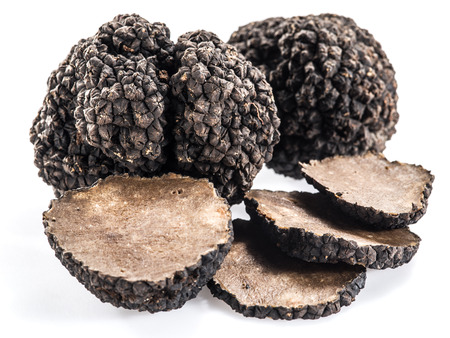 Black truffles isolated on a white background.の写真素材