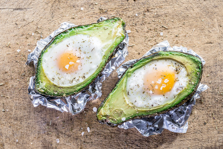 Chi?ken egg baked in avocado. Delicious meal.の写真素材