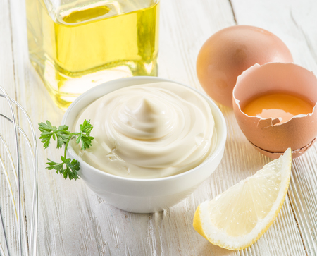 Natural mayonnaise ingredients and the sauce itself.の写真素材