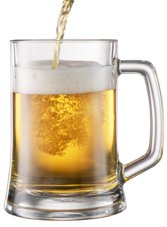 Beer pouring into the mug.の写真素材