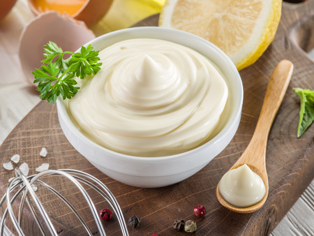 Natural mayonnaise ingredients and the sauce itself.の写真素材