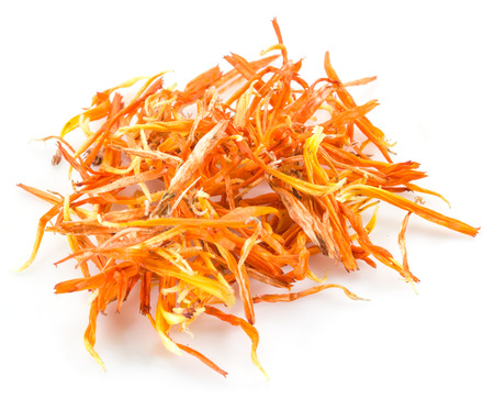 Dry marigold or calendula florets on a white background.の写真素材