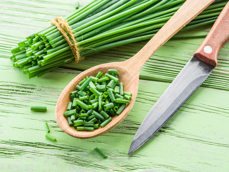 Green onion on the wooden table.の写真素材