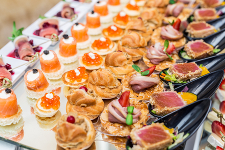 Gourmet appetizers: caviar, venison, tuna and salmon.の写真素材