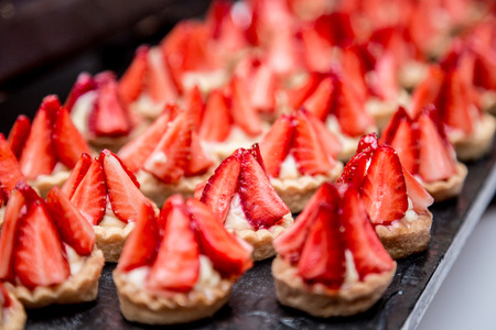 Canapes with strawberry dessert on the banquet table.の写真素材