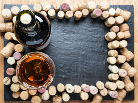 Wine corks arranged as frame on the graphite board.の写真素材