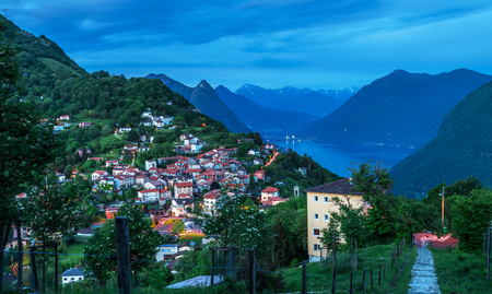 View from Monte BrÃ¨ Mountain of night village and range of mountains.の写真素材