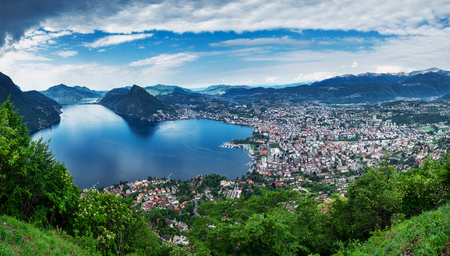 Lugano, Switzerland, May 12, 2018. Beautiful panoramic view of  Lugano city from Monte BrÃ¨ Mountain.の写真素材