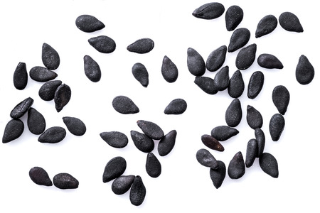 Several black sesame seeds isolated on white background.の写真素材