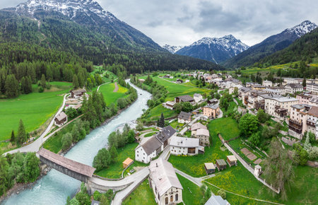 Lavin, Switzerland, May 13, 2018. Beautiful view of Lavin municipality situated on the Inn river bank between mountains. Piz Quattervals.のeditorial素材