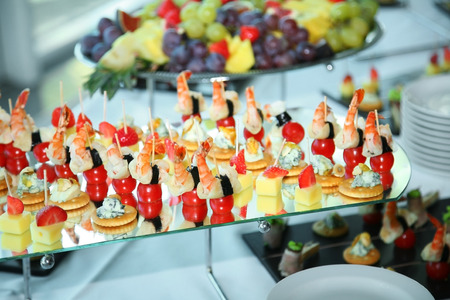 Different fruits and light appetizers provided during catered events. Close-up.の写真素材