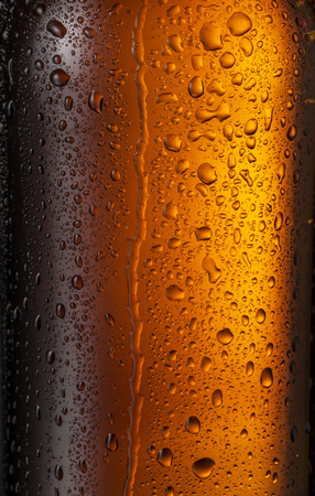 Misted glass of beer bottle. Close up shot.の写真素材